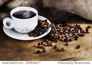 hot coffee cup and roast coffee beans on a wooden table. dark background